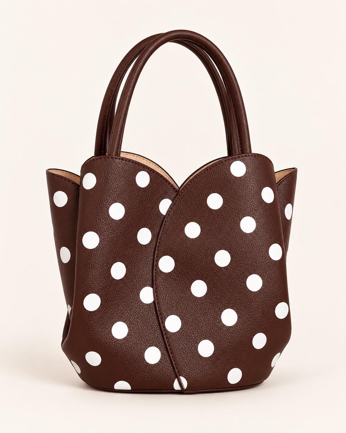 Chocolate-brown tulip tote with white polka dots and twin handles.